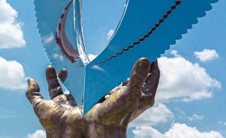 hands with clouds in background